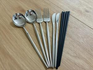 a group of forks and spoons on a table at Corpo SKR by Tranova in Musashino