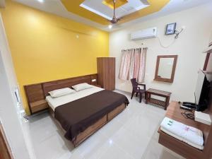 Un televizor și/sau centru de divertisment la Sakthi Residency