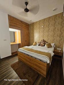 a bedroom with a large bed and a window at The Agra Retreat-walk to the Taj Mahal in Agra