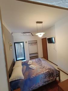 ミラノにあるCasettaNovaraの部屋にベッドがある寝室
