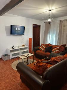 TV a/nebo společenská místnost v ubytování Finca Huerta El Rincón