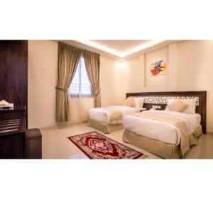 Ένα ή περισσότερα κρεβάτια σε δωμάτιο στο Palette Al Louloah Al Baraqah Aparthotel +18 φωτογραφίες