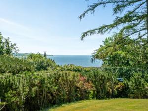 a view of the ocean from a garden at Holiday Home Bisera - 150m from the sea by Interhome in Fåborg