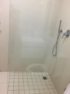 a bathroom with a shower with a toilet at Ballito Sands in Ballito