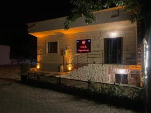 a building with a sign for a bar at night at Era Cappadocia in Uçhisar