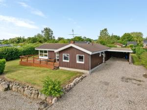 a home with a large yard with a house at Holiday Home Ellyn - 500m from the sea by Interhome in Haderslev