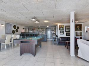 a room with a pool table and a bar at Apartment Henne - 2-5km from the sea by Interhome in Humble +31 photos