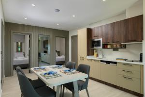 a kitchen and dining room with a table and chairs at Ayaz Suites in Bodrum City