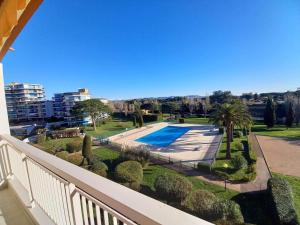 a balcony of a house with a swimming pool at Appartement 3P Résidence La Napoule Village Plage in Mandelieu-la-Napoule +11 photos