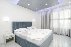 Кровать или кровати в номере APART-HOTEL PRESiDENT 2