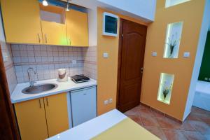 Η κουζίνα ή μικρή κουζίνα στο Apartments House 91 +38 φωτογραφίες