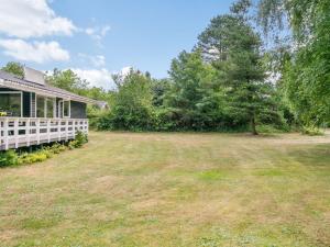 an empty yard next to a house at Holiday Home Giertrud - 500m from the sea by Interhome in Humble