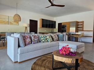 a living room with a couch and a table at Villa Solenzara - Private Luxury Residence Nosy Be in Nosy Be