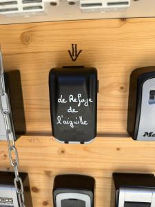 a black object with writing on it on a table at Nouveau Refuge de l aiguille in Chamonix-Mont-Blanc