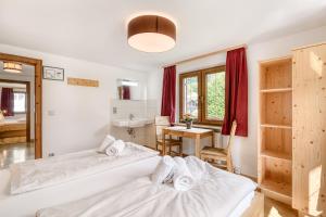 Postel nebo postele na pokoji v ubytování Jagdhaus Walch + 16 fotografií
