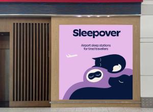 a sign on the side of a building at Sleepover Terminal 3, Concourse A - formerly sleep 'n fly in Dubai
