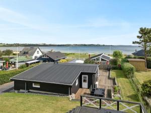 an aerial view of a house with a black roof at Holiday Home Elain - from the sea by Interhome in Broager