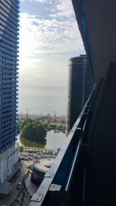 a view of a river in a city with tall buildings at Studio Suite with balcony in Batumi