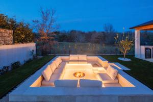 a fire pit in the middle of a yard at Villa Neoma in Linardići