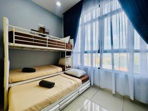 two bunk beds in a room with a window at Group-Friendly Stay in Putrajaya & IOI City Mall in Putrajaya +15 photos