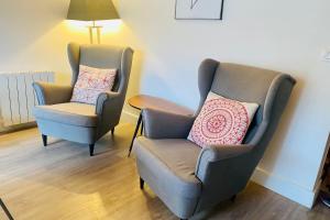 two chairs sitting next to each other in a room at Vars at the foot of the slopes - apartment for 6 people in Vars