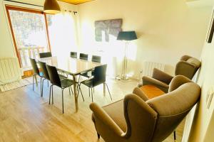 a living room with a dining room table and chairs at Vars at the foot of the slopes - apartment for 6 people in Vars