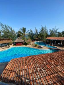 a large swimming pool in a resort at Serene Sea View One Bedroom Apt Shanzu in Mombasa +11 photos