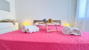 Postel nebo postele na pokoji v ubytování Appartamento Madagascar by Ca-Sa Check