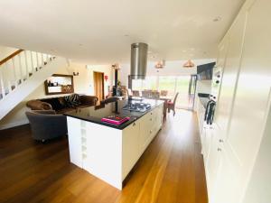 a kitchen and living room with a counter top at The Parlour in Helsby