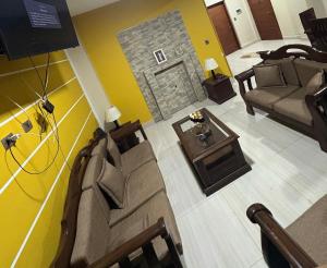 a living room with a couch and a table at Luxury House in Cochabamba