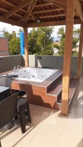 a bath tub sitting on top of a patio at Luxury House in Cochabamba