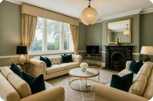 a living room with two couches and a fireplace at Lodge - Sleeps 18 pet friendly & free parking in Ravensworth