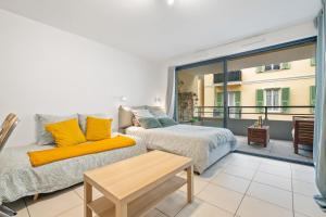 Postel nebo postele na pokoji v ubytování Cozy studio with terrace, Monaco and beach 5 min away + 28 fotografií