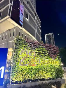 a building with plants on the side of it at 22 Macalisterz 2025 Georgetown Premium 顶楼无边泳池 in George Town