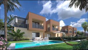 a villa with a swimming pool and palm trees at Palm Villas in Manerba del Garda