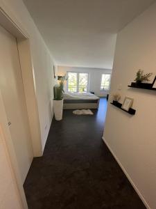 a bedroom with a bed and a window at Exklusives und zentrales Wohnen direkt am Marktplatz in Balingen