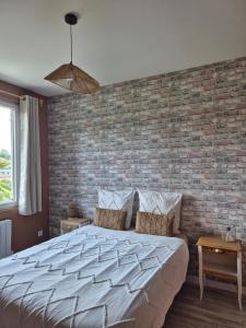 Ένα ή περισσότερα κρεβάτια σε δωμάτιο στο Le Millésime