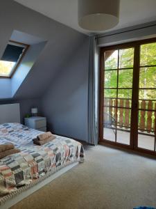 Katil atau katil-katil dalam bilik di Apartament 24 Karpacz