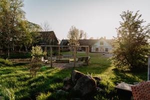 a yard with a house in the background at Strömma Farmlodge B&B in Tvååker