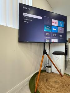 a flat screen tv hanging on a wall at Fully equipped brand new built studio in Chipping Norton +3 photos