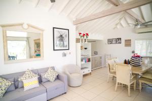 a living room with a couch and a table at Antigua Bay Villa in Bats Cave