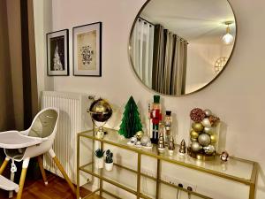 a dressing table with a mirror and a chair at Appt Vue Parc Disneyland-PARIS - Terrasse - Parking Privé in Chessy