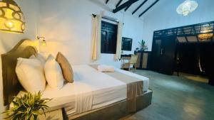 Ένα ή περισσότερα κρεβάτια σε δωμάτιο στο Villa Tamarind - Tangalle