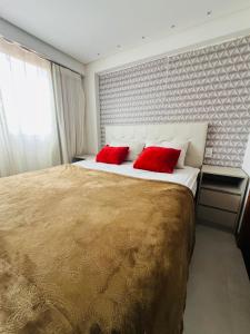 Ένα ή περισσότερα κρεβάτια σε δωμάτιο στο Exclusive Beira Mar