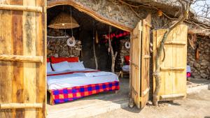Una cama o camas en una habitación de Maasai Sacred Site - Africa Amini Life