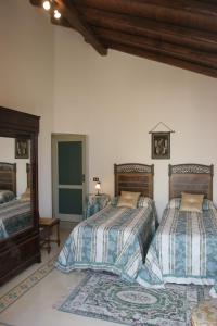 Postel nebo postele na pokoji v ubytování B&B Palazzo Gambino