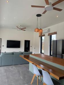 a living room with a table and a couch at Villa Selva, Lamai in Amphoe Koh Samui