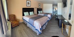 Ένα ή περισσότερα κρεβάτια σε δωμάτιο στο Denver City Motel