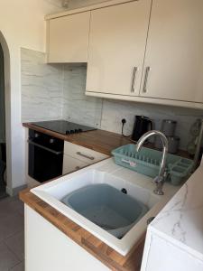 a kitchen with a large sink in a kitchen at Beautiful Apartment in Burstwick