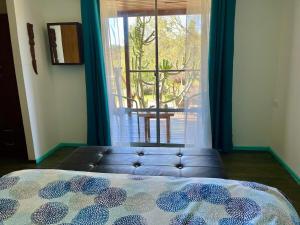 Postel nebo postele na pokoji v ubytování Kaape House